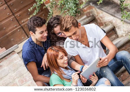 Group of Teenage Friends with Tablet PC