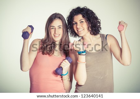 Two Women with Light Weights at Gym