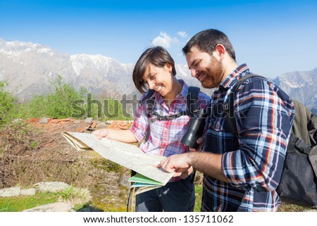 Young Couple Hiking Looking at Map
