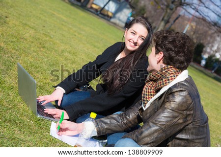 Young Couple with Computer at Park in Wien