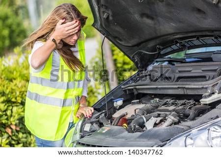 Young Woman with Damaged Car