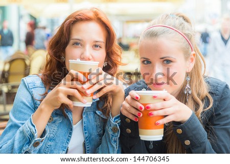 Teenage Girls Drinking at Bar