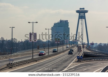 BRATISLAVA, SLOVAKIA - MARCH 23: New futuristic bridge with skyscrapers on background on March 23, 2013 in Bratislava, Slovakia.