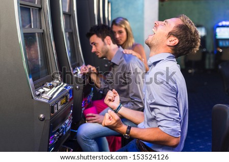 Group of Friend Playing with Slot Machines