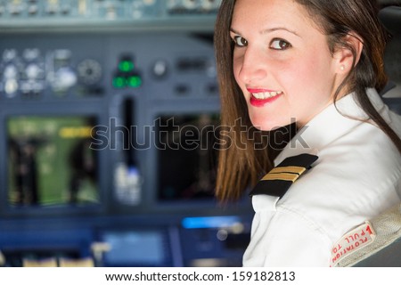 Female Pilot in the Airplane Cockpit