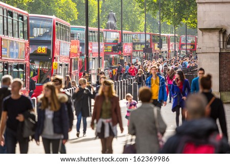 LONDON, UNITED KINGDOM - OCTOBER 25: Crowded Palace of Whitehall Street with many red double-decker buses  on October 25, 2013 in London, United Kingdom.