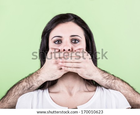 Man Covering Mouth of Woman with Hands