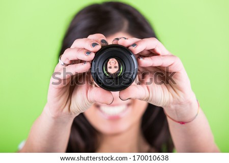Woman Looking Through Photographic Lens