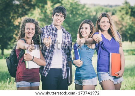 Teenage Students with Thumbs up