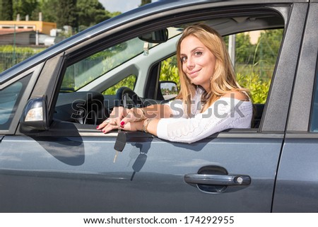 Happy Young Woman Showing Car Key