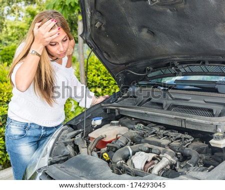 Young Woman with Damaged Car