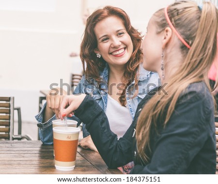 Teenage Girls Drinking at Bar