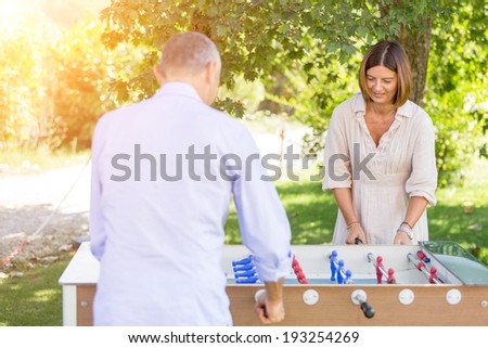 Adult Couple Playing with Table Football