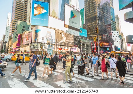 NEW YORK, USA - AUGUST 20, 2014: Times Square crowded of tourists at late afternoon. More than 300 thousand people visit this square every day.