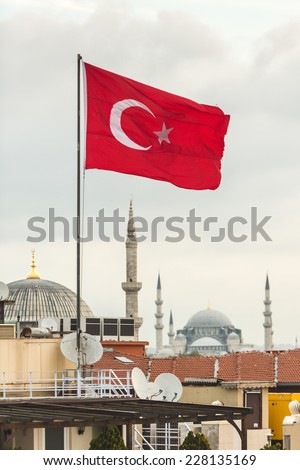 Turkish Flag and Istanbul Rooftops View with Mosque on Background