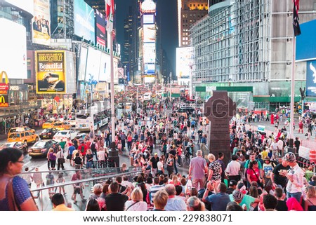NEW YORK, USA - SEPTEMBER 4, 2014: Times Square crowded of tourists at late afternoon. More than 300 thousand people visit this square every day.