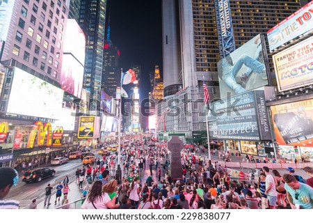NEW YORK, USA - SEPTEMBER 4, 2014: Times Square crowded of tourists at late afternoon. More than 300 thousand people visit this square every day.