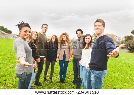 Multiethnic Group of Friends Giving a Hand