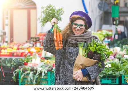 Young Woman Buying Vegetables at Local Market