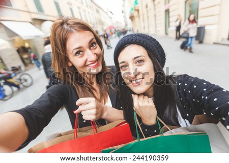 Happy Women Taking Selfie after Shopping. Taking Selfie and Sharing Photos on Social Networks is very common and fashion at the moment
