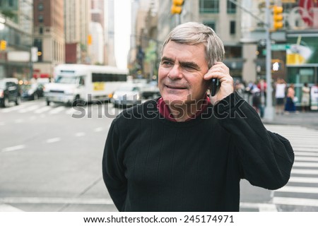 Senior Man Talking on Mobile Phone in New York