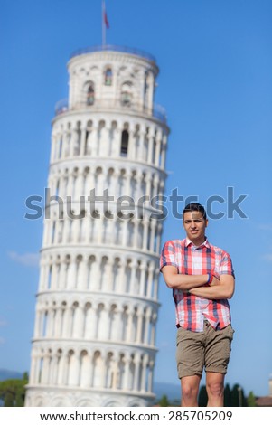 Young Boy Posing with Leaning Tower in Pisa