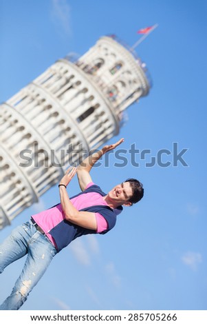 Young Man Posing with Leaning Tower in Pisa