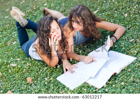 Two Young Woman Study Togheter at Park