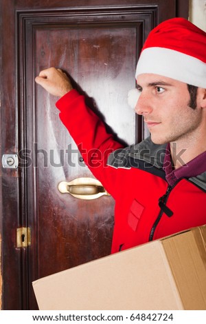 Delivery Boy with Christmas Hat Knock at the Door