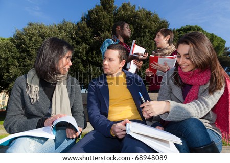 college students studying. stock photo : College Students Studying Together at Park