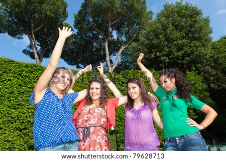 Happy Teenage Girls with Outstretched Arms
