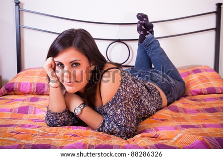Pensive Woman on the Bed