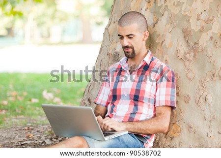 Young Man With Computer at Park