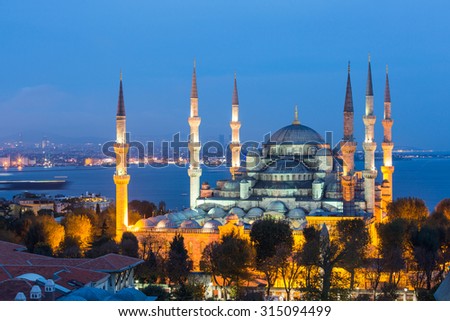 Aerial view of Blue Mosque in Istanbul at night. This is one of the most important islamic place where people go to pray. On background there are Bosphorus strait and Asian side of the city.
