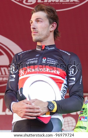 SIENA, ITALY - MARCH 03: Fabian Cancellara, winner of Strade Bianche 2012, on the podium, on March 03, 2012 in Siena, Italy