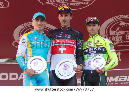 SIENA, ITALY - MARCH 03: Fabian Cancellara, Maxim Iglinskiy and Oscar Gatto on the podium of Strade Bianche 2012, on March 03, 2012 in Siena, Italy