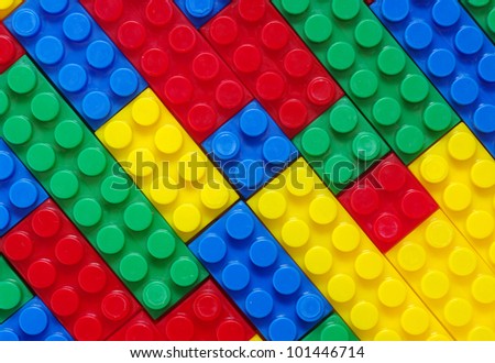 stock-photo-toy-background-made-with-color-plastic-bricks-101446714.jpg