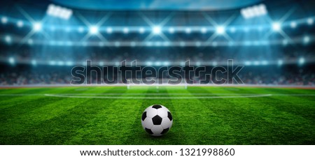Soccer ball on stadium background