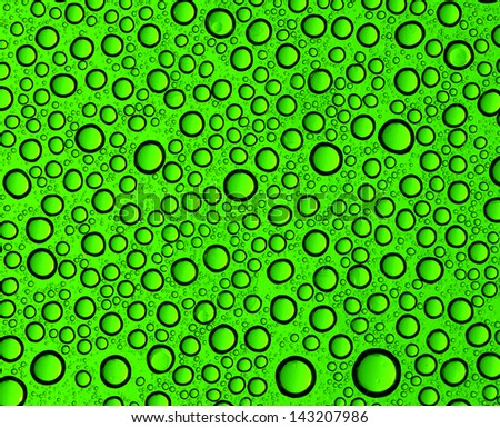 green water drops on glass