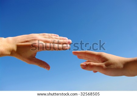 Extended hand for help on a sky background