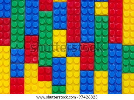 toy background made with color plastic bricks
