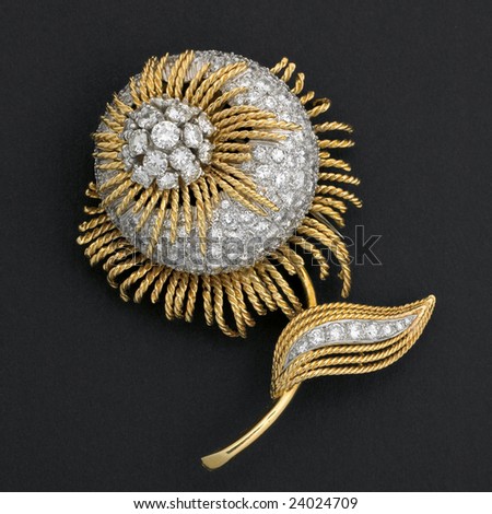 Diamond studded gold flower brooch