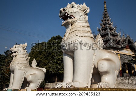 White Lion statues provide protection at the base of Mandalay Hill in Myanmar.