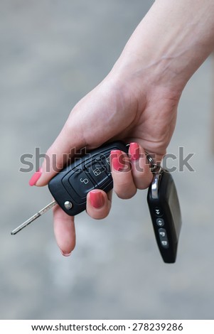 Car Keys. Seller woman hand giving keys