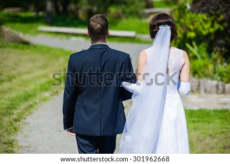 Groom with bride before wedding ceremony in church