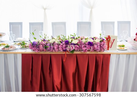 Wedding celebration table with bouquet. Decor trend