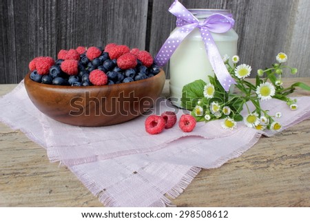 Vintage composition with top of milk and ripe berries