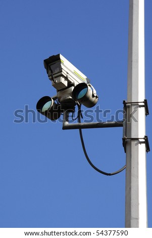Traffic camera against blue sky