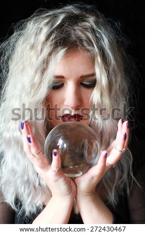 A beutiful woman holding a crystal ball. The fortune teller