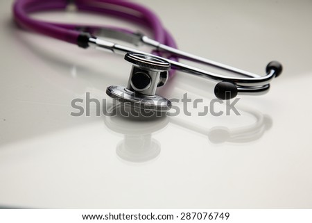 Closeup of a medical stethoscope, isolated on white background.